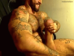 Exceptionally muscled man, awesome tats and a great looking silicone