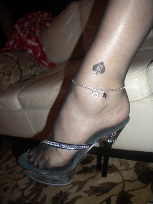 postyourslut:  Black Mini Dress, Black Nylons, a Queen of Spades Tattoo and Anklet.  She will have no trouble finding a BBC!