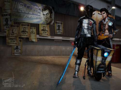 protowilson:  guzzardiart:  Borderlands 2 cosplay with our life-size Claptrap model/propMel Guzzardi as Zer0 and Shenae Guzzardi as Handsome Jack. All costumes, props and Claptrap are handmade and hand painted by us. Video of Claptrap doing his thing