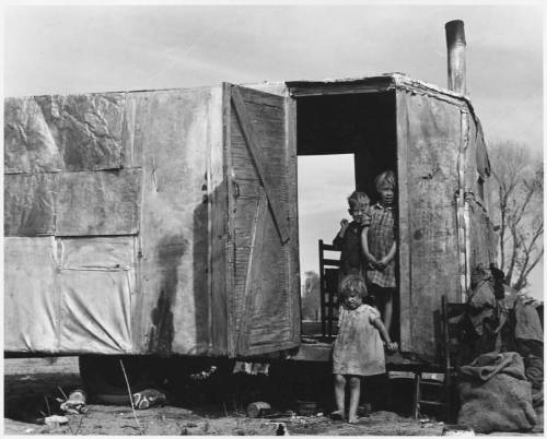  The children of a migrant family living in a trailer in the