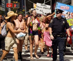 nudiarist2:  Bare-breasted women parade through New York for
