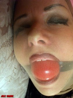 nylonencasementart:  Love the lipstick and gag behind the encased