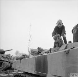 historicaltimes:  A little Dutch boy helps to refuel a British