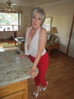 She look very hot sexy Granny ,In front of her lower stomach in middle between legs look very hot sexy red panties very tightly outifit perfect hot red round so curves bump !! I feel very horny hard on her., I feel like want have sex horny her.. 
