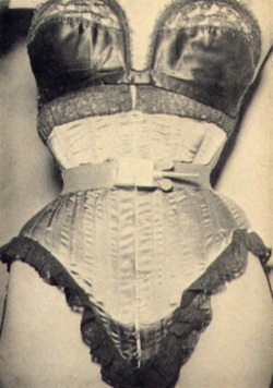 undressingparlour: Corset with metal waist cinch, screw and wingnut
