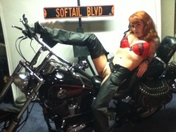 A hot, mature Heavenly Redheads fan on a Harley, spreading her