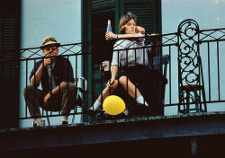 20aliens:  Three friends look down from a balcony in New Orleans,