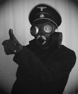 taintedgarden:  Model Nazi officer, wearing a gas mask for advertising