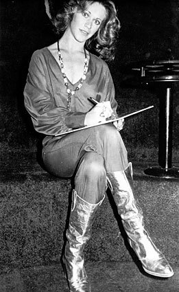 Signing copies of her disco single “Benihana,” 1977