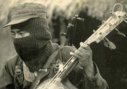 cromagnetism:  Zapaista soldier playing a three stringed guitar.