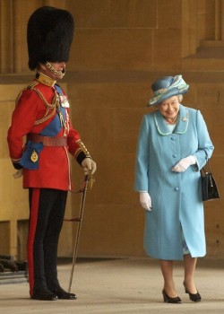 Jocularity (Queen Elizabeth laughs as she walks by her husband