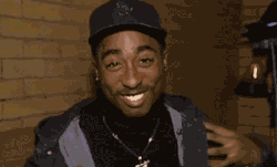 inhalethepoetry:  Pac laughing;) 