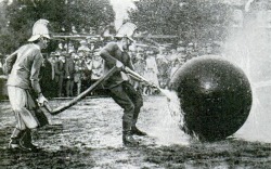 An exciting moment in the game of firemen’s pushball. With