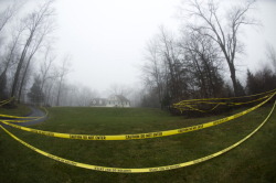 dichotomized:  Crime scene tape hangs outside the home of Nancy