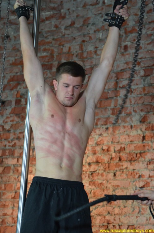 muscled stud suspended and flogged closeties1:  “Captured Worker” pt.1` 