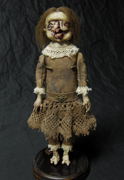 sixpenceee:  Shain Erin’s morbid mummy and zombie dolls. Dare