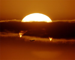 letsbuildahome-fr:  Partial Solar Eclipse with Airplane © Phillip