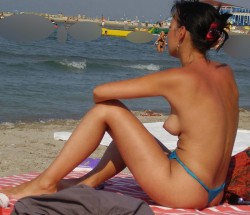 topless girl with nice tits on the beach
