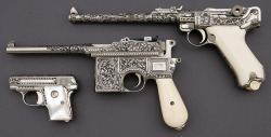 twippyfan:Ivory and Pearl gripped pistols. Heavily engraved.