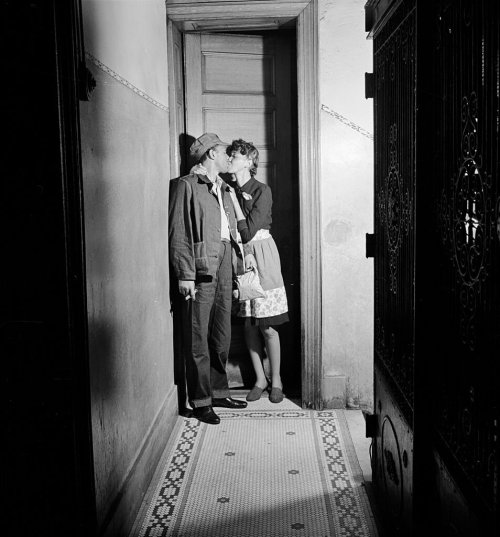 A couple kissing in the hallway, Harlem, 1942 by John Florea