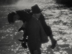  Clark Gable gives Claudette Colbert a lift in It Happened One
