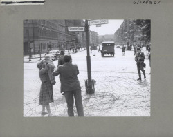 furtho:  A child is passed over barbed wire from East to West