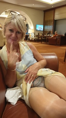 mature-romantic:  Drinking wine in the lobby, the look in her