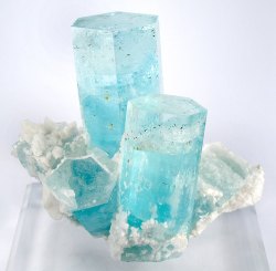 fuckyeahmineralogy:  Aquamarine (beryl) with schorl; Pakistan