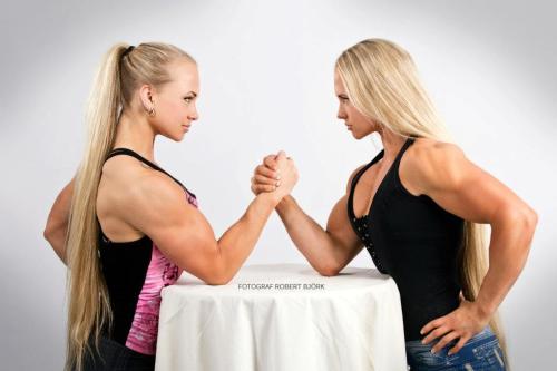 Twin Absolute Women arm wrestling… Tons of pressur in each arm. Both ar class 3, its a colossal battle that any machine could stand.