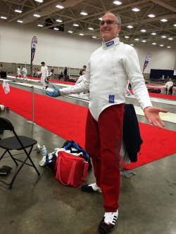 modernfencing:  [ID: an epee fencer posing in a pair of dark