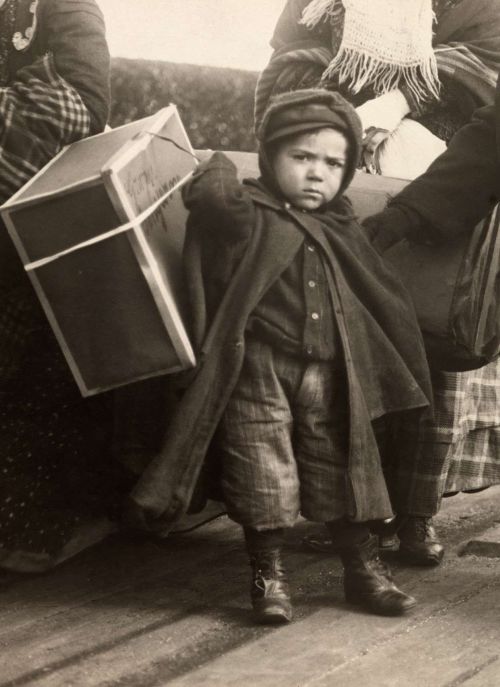 An Italian child arriving at Ellis Island, early 1900s. Nudes