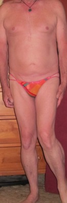 Full body shot, orange multi colered G-string.