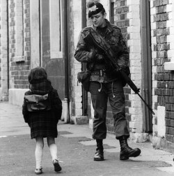 empathyisvital:  A solider on patrol talks to a child in Belfast,