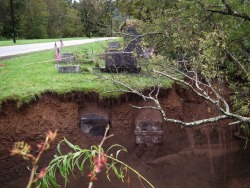 sixpenceee:  “Coffins at a cemetery in Lawton, PA become exposed
