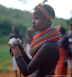 african-eyes:a—fri—ca:  Massai young woman from Kenya by Henk van der Leeden The Maasai are a Nilotic ethnic group of semi-nomadic people inhabiting Kenya and northern Tanzania. They are among the best known local populations due to their residence