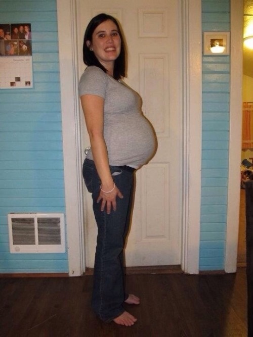pregnantbellys:  Sexy mommy showing off her big preggo belly