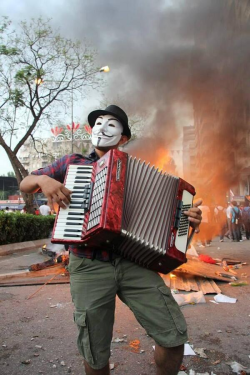 occupygezipics:  A man plays the accordion in Adana behind the