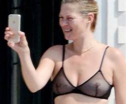 starprivate:  Kate Moss does topless in seethrough bra  The