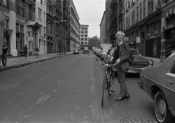 A rare photo of Andy Warhol getting ready to ride his bike down