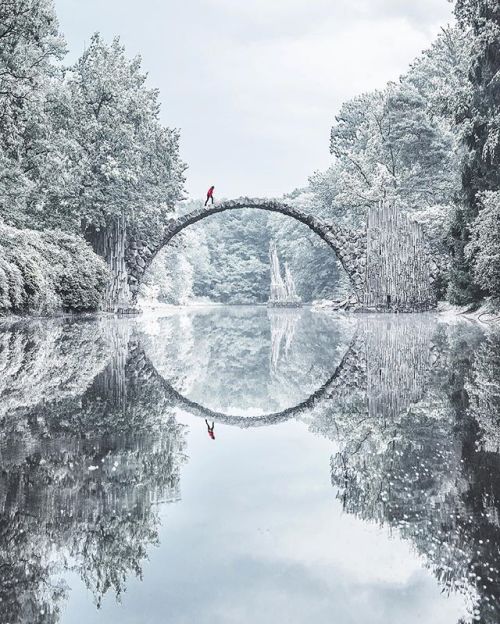 jonlovett: jengatower:  burntcopper: Kromlau bridge, Germany, during all four seasons. Is this real???  holy shit 