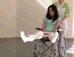 Sexy female patient gets two LLC, with wheelchair and crutches