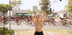 Blonde is a topless cheerleader for this bike race!!Live webcam