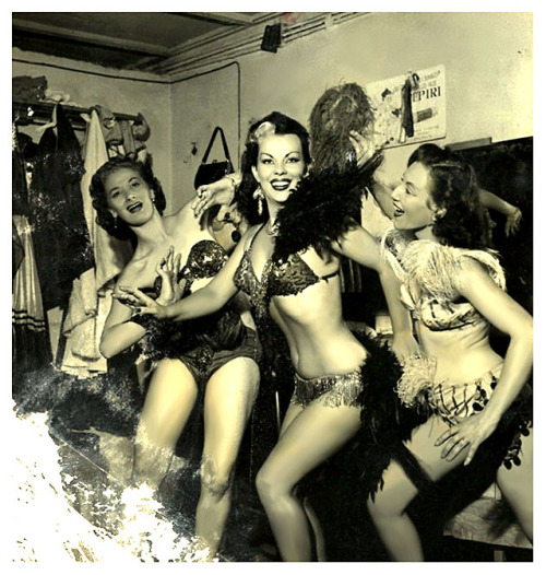 Vintage 50’s-era photograph captures Tongolele posing with a pair of fellow showgirls, in the dressing room of an unidentified nightclub..