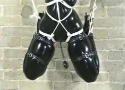 rubberdollowner:  http://rubberdollowner.tumblr.com This is a visual masterpiece of whimsy & serious suspension play.  The devil is in the details, the inflatable hood & plug with the posture collar, The white ropes that are used to highlight