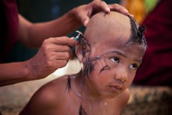 natgeotravel:  A young boy participates in ceremonial preparation