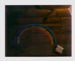 i drew a rainbow on my floor. and i took a polaroid of it. and