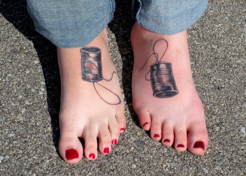 fuckyeahtattoos:   My best friend of 13 years and I got coordinating tin can telephones tattooed on our feet. They were done in october on my 18th birthday by Britton Ashbury of Blue Byrd Tattoo in Dayton, Ohio. We both absolutely love the way they turned