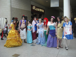 thedailywhat:   Killer Cosplay of the Day: Zombie Disney Parade cast members line up outside ExCeL London, where the London MCM Expo is hosted annually. Many more photos can be found here. [via.]   It amuses me way too much that Mulan has a half dead