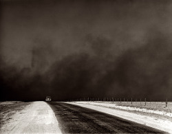 Heavy black clouds of dust rising over the Texas Panhandle photo