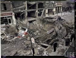 London Bus laying inside huge bomb crater after heavy German